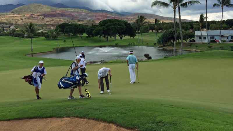 Kapolei  Golf Course and watching Davis Love get ready to putt