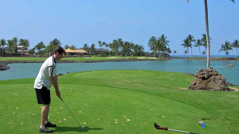 Teeing off on the 12th over the lake at Mauna Lani South